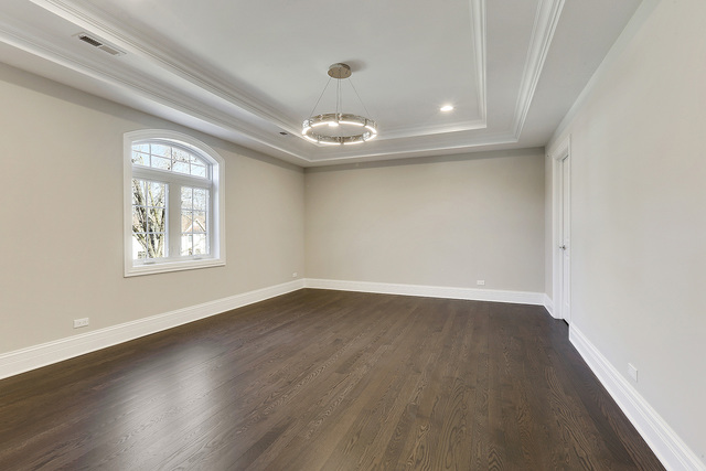 1851 Beechnut Road Northbrook, IL 60062 - Photo 31 of 40 an empty room with wooden floor and windows
