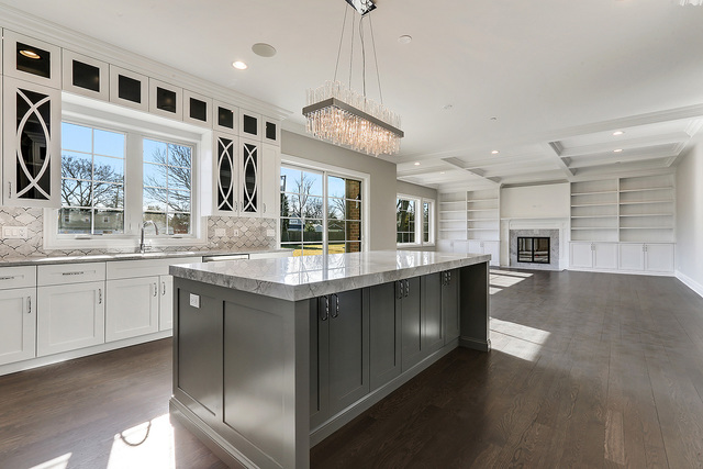 1851 Beechnut Road Northbrook, IL 60062 - Photo 5 of 40 a large kitchen with stainless steel appliances granite countertop a large kitchen island a stove a sink a dining table and chairs
