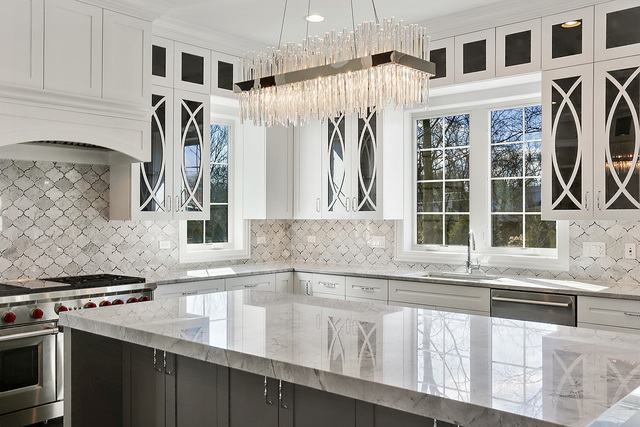 1851 Beechnut Road Northbrook, IL 60062 - Photo 6 of 40 a kitchen with granite countertop a sink and a stove top oven