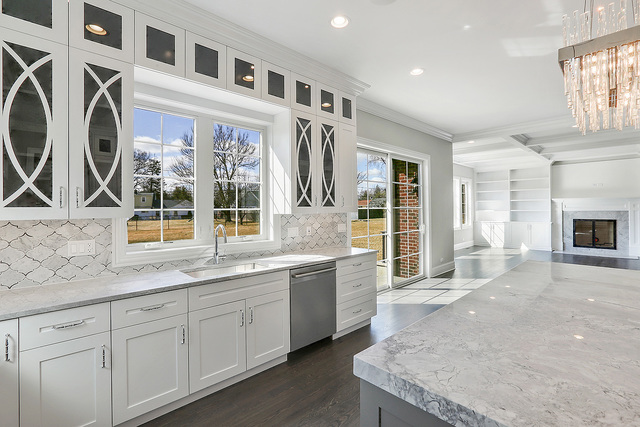 1851 Beechnut Road Northbrook, IL 60062 - Photo 8 of 40 a hall with kitchen island granite countertop a sink and a stove top oven