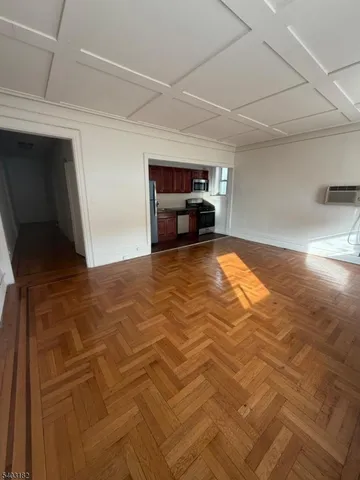 a view of a livingroom with furniture and flat screen tv