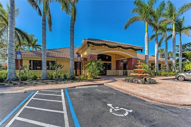 a view of a brick house with a patio