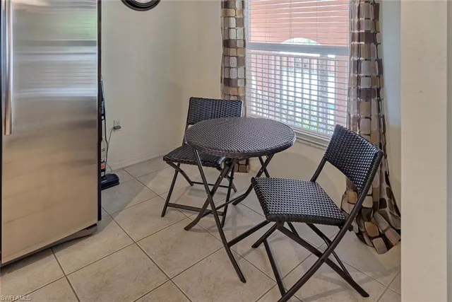 a view of a room that has a table and chair