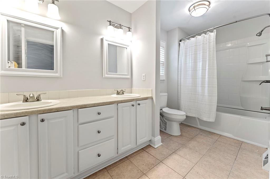 5401 Tower Road Greensboro, NC 27410 - Photo 16 of 21 2nd full bathroom upstairs with dual vanity