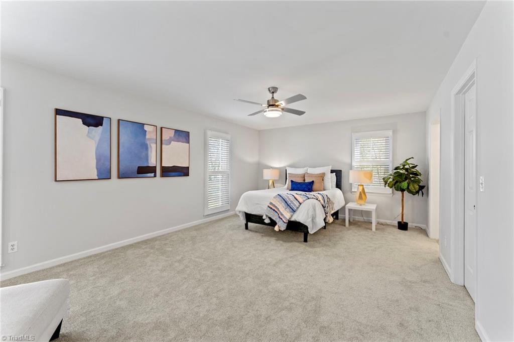 5401 Tower Road Greensboro, NC 27410 - Photo 9 of 21 Oversized primary bedroom on the main level