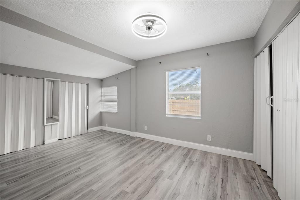 605 South Disston Avenue Tarpon Springs, FL 34689 - Photo 13 of 47 a view of a room with wooden floor and window