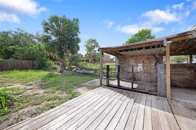 a view of a backyard with sitting area