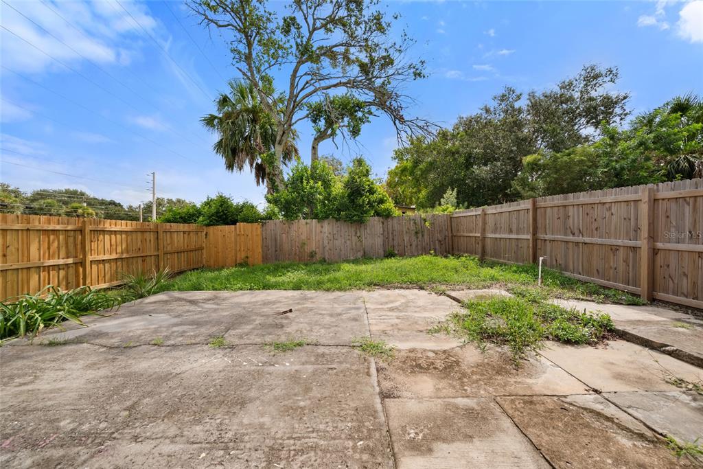 605 South Disston Avenue Tarpon Springs, FL 34689 - Photo 40 of 47 a garden with trees in the background