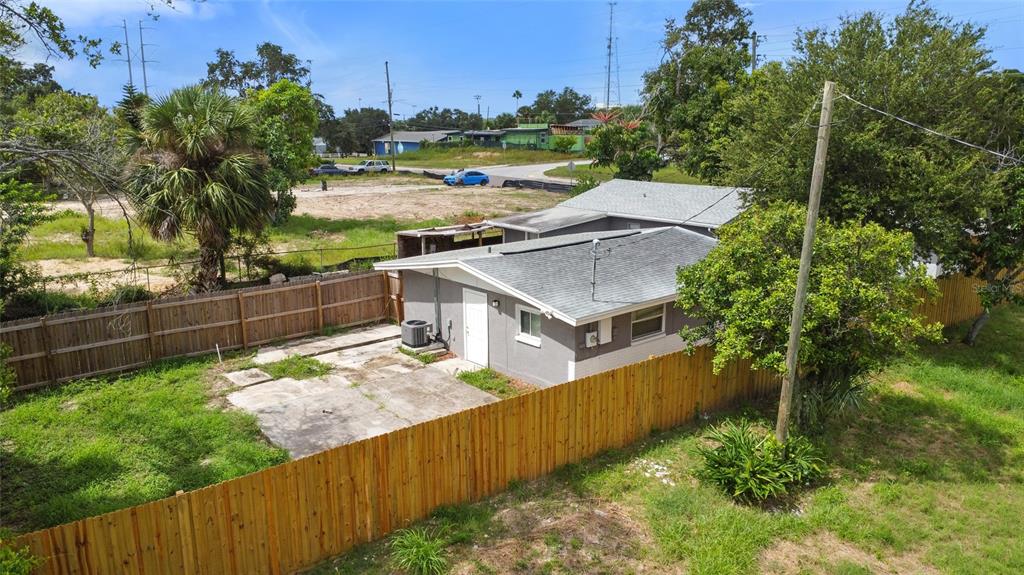 605 South Disston Avenue Tarpon Springs, FL 34689 - Photo 41 of 47 a balcony with table and chairs and wooden fence