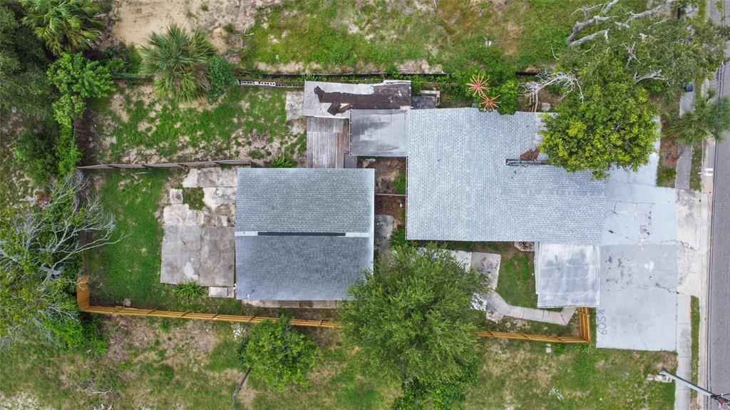 605 South Disston Avenue Tarpon Springs, FL 34689 - Photo 43 of 47 an aerial view of a house with a yard and lake view