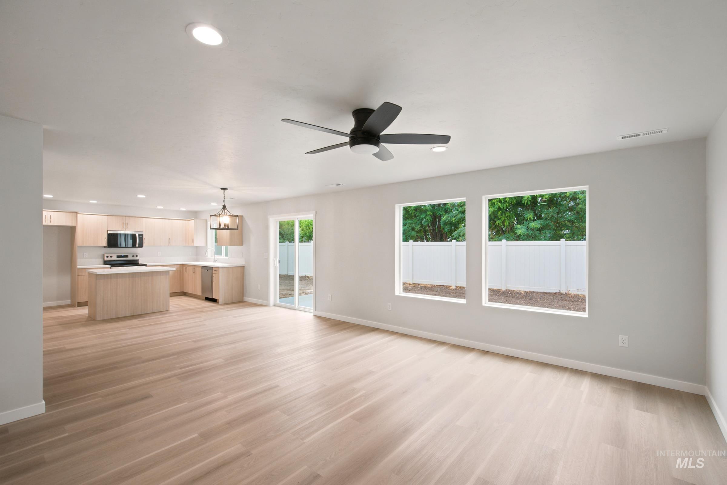 472 Merlin Court Middleton, ID 83644 - Photo 9 of 25 Wood-finish flooring throughout, recessed lighting, and a modern ceiling fan