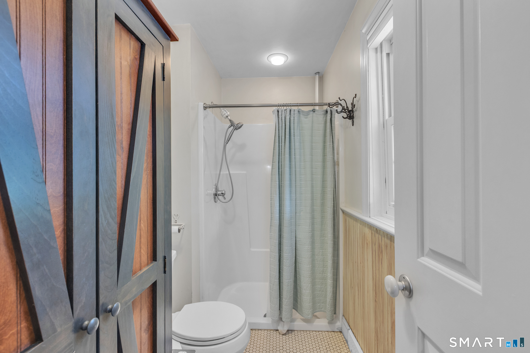 808 Branch Road Suffield, CT 06078 - Photo 19 of 40 a bathroom with a shower toilet and sink