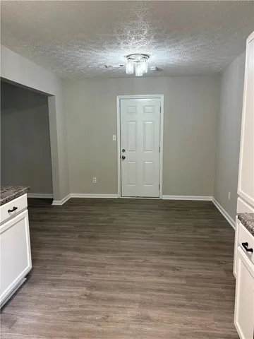 a view of a livingroom with wooden floor