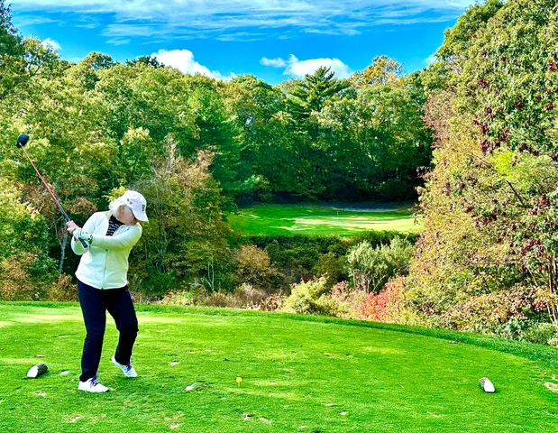 a bathroom with a toilet and a garden