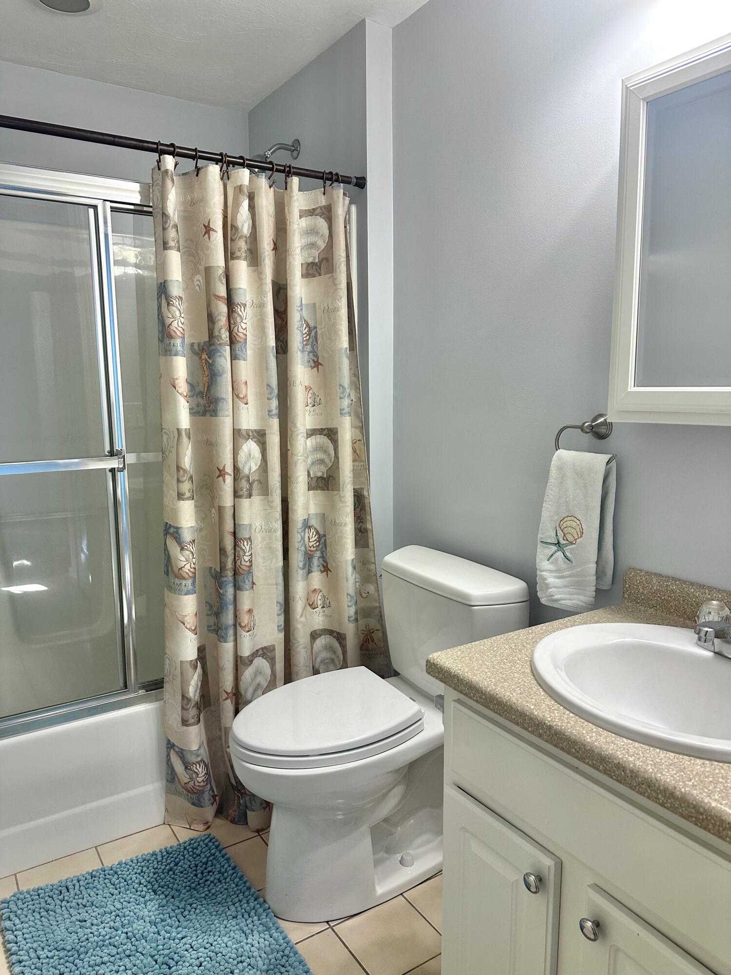 4 North Ridge Road Mashpee, MA 02649 - Photo 14 of 26 a white toilet sitting next to a bathroom sink