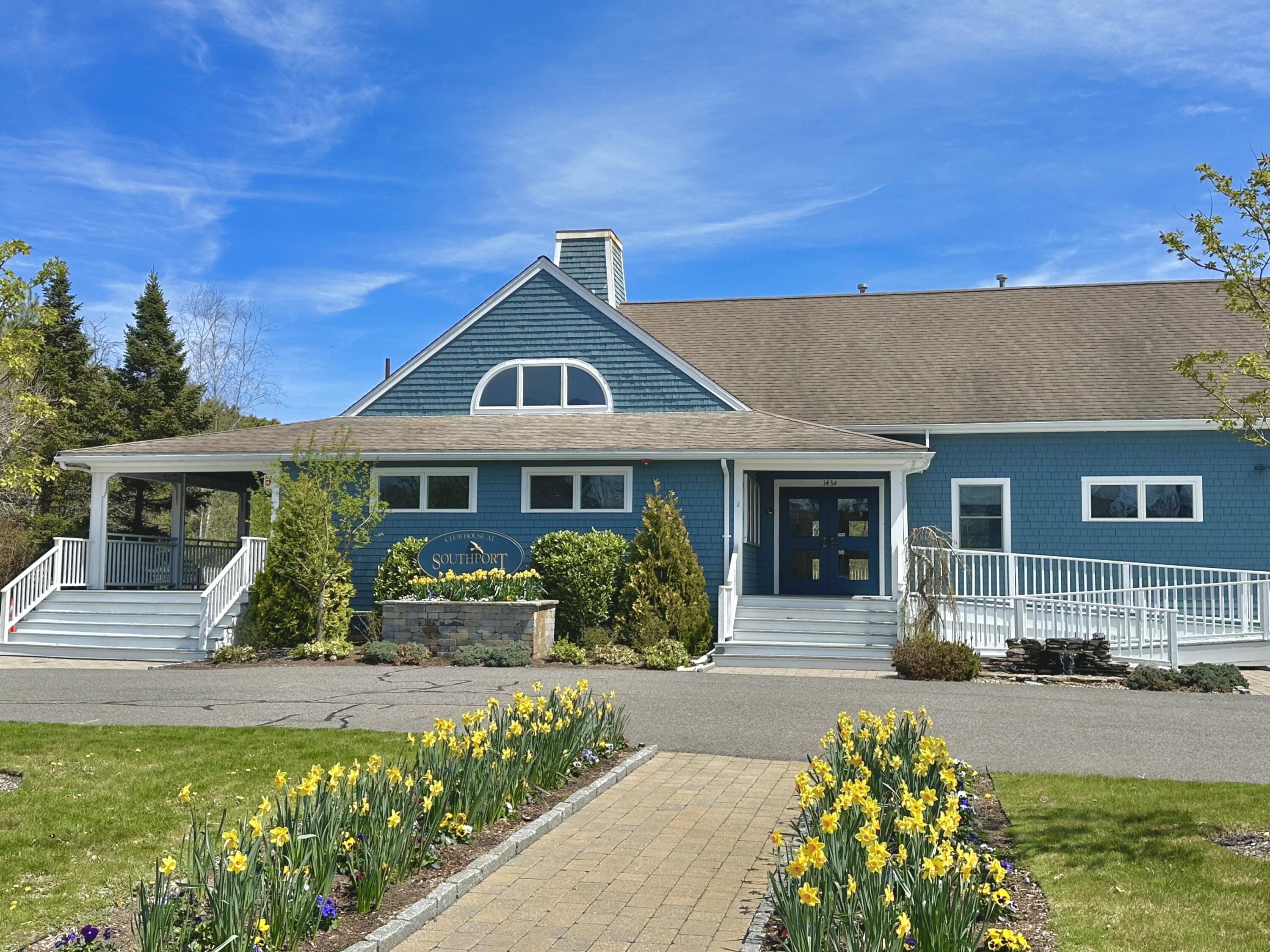 4 North Ridge Road Mashpee, MA 02649 - Photo 24 of 26 a front view of a house with a garden