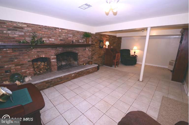 41 Sheridan Road Arnold, MD 21012 - Photo 8 of 30 Basement Fireplace and Sitting Room