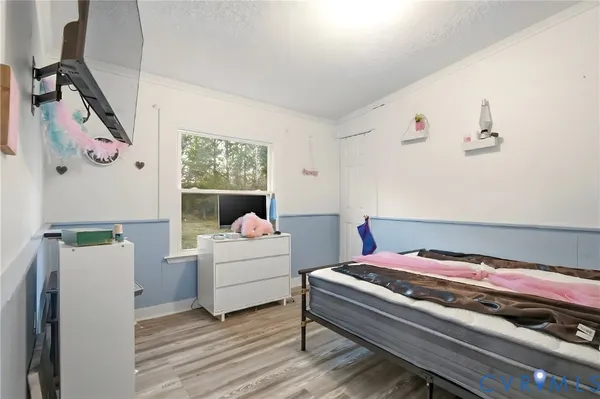 a bed room with a bed and a window