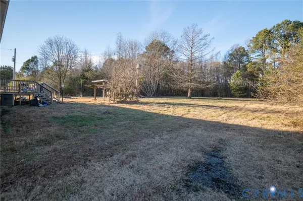 a view of a yard with trees