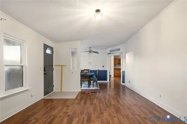 a view of a livingroom with furniture and a window