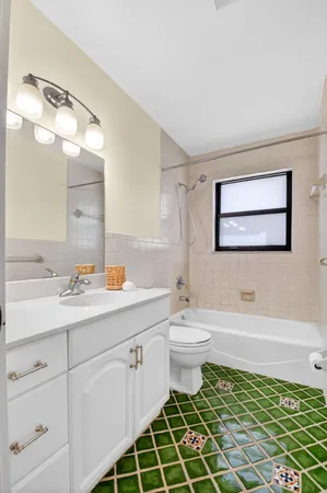 a bathroom with a sink toilet and mirror
