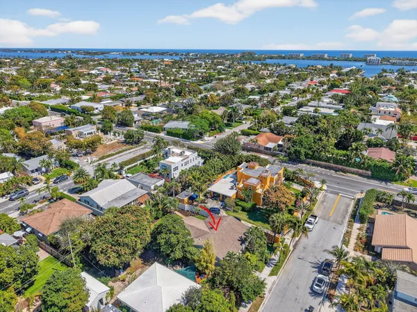 an aerial view of residential houses with outdoor space