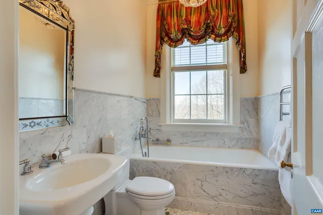 a bathroom with a sink a toilet and a bathtub