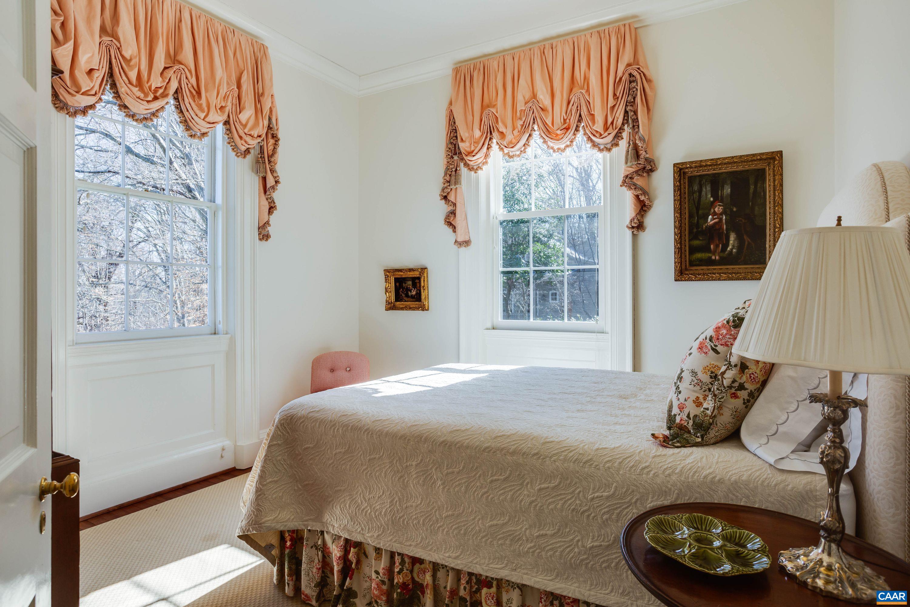 1790 Lambs Road Charlottesville, VA 22901 - Photo 20 of 53 a bed sitting in a bedroom next to a window