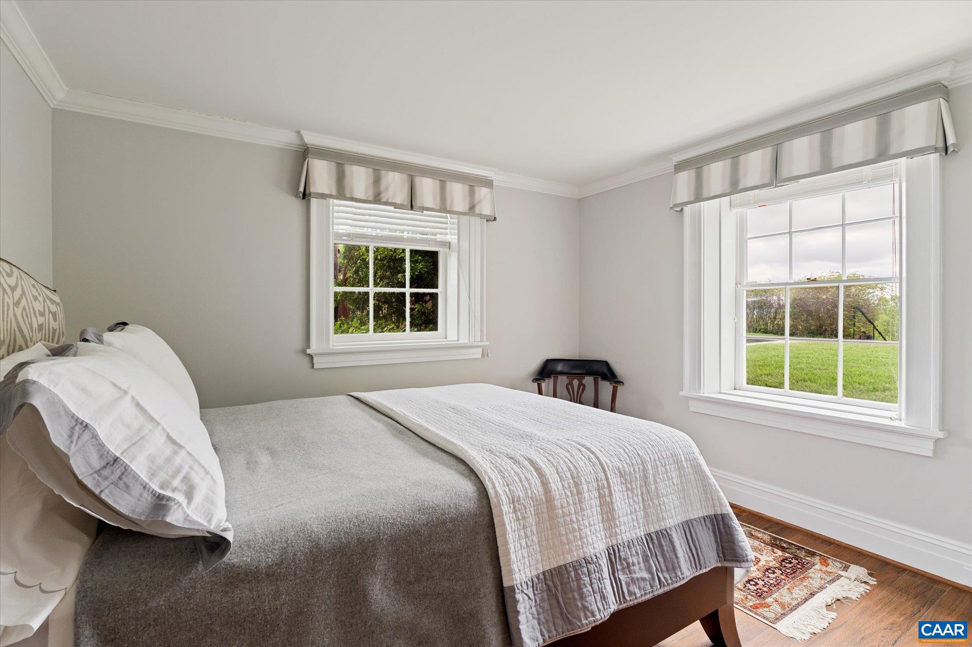 1790 Lambs Road Charlottesville, VA 22901 - Photo 27 of 53 a bedroom with a bed and wooden floor