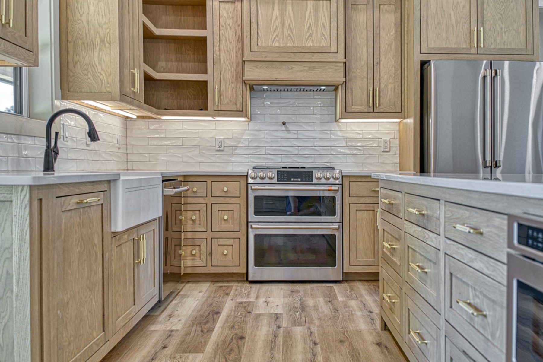 9355 Fox Hill Road Baxter, TN 38544 - Photo 9 of 34 a kitchen with stainless steel appliances granite countertop a stove a sink and a microwave