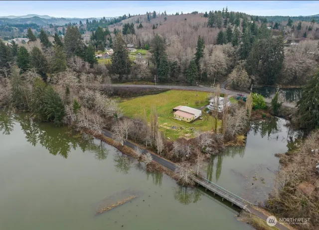 an aerial view of a house with a lake view