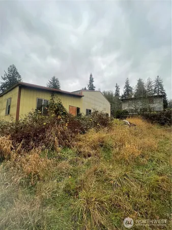 a view of a lake with houses in the back