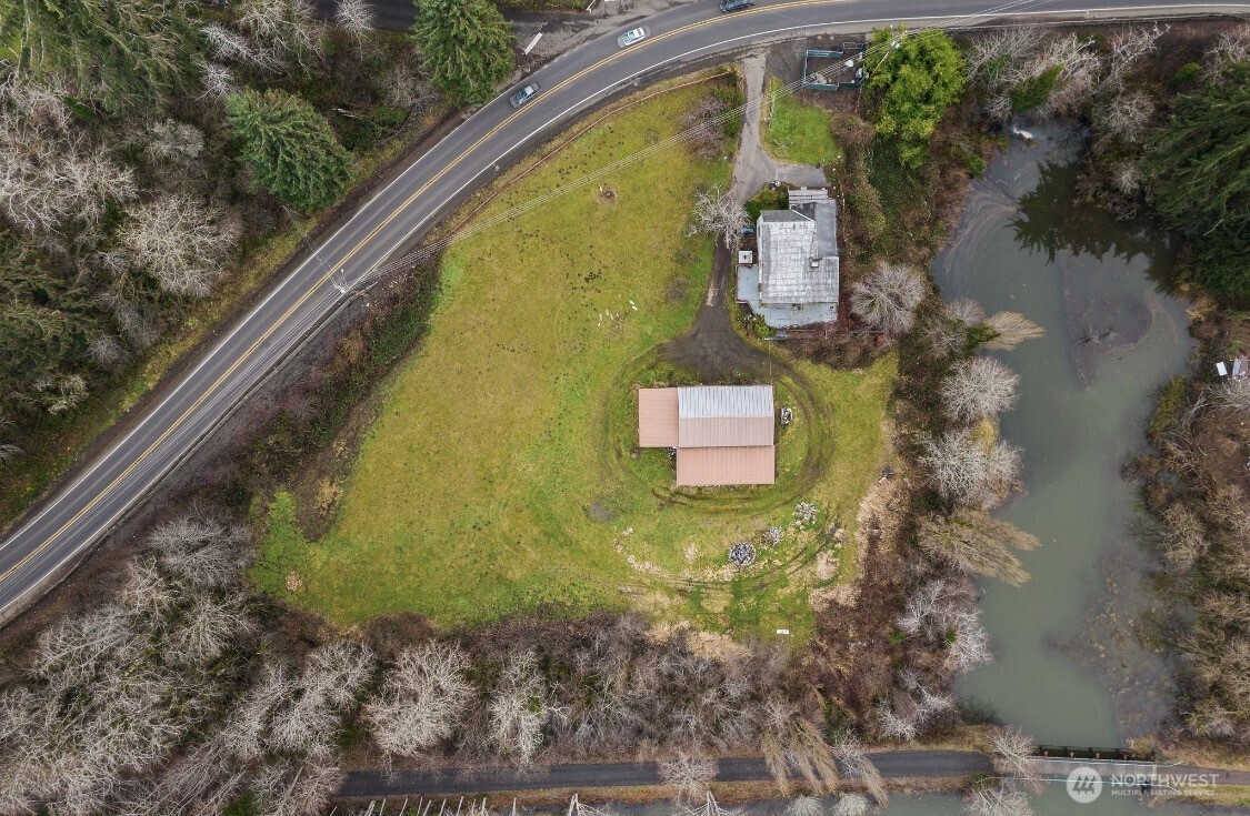 1632 Henkle Street Raymond, WA 98577 - Photo 2 of 12 a view of swimming pool with a yard
