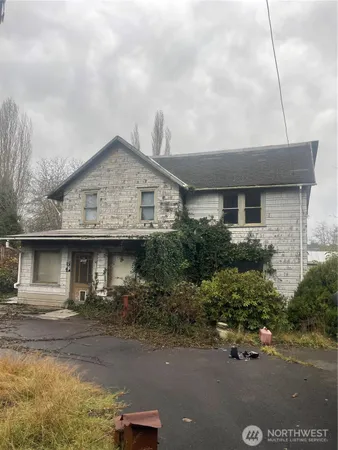 a front view of a house with garage