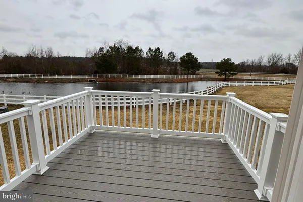 a view of wooden deck and lake