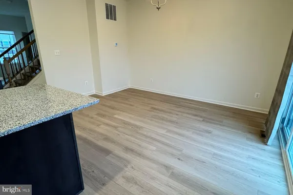a view of kitchen island wooden floor and wooden floor