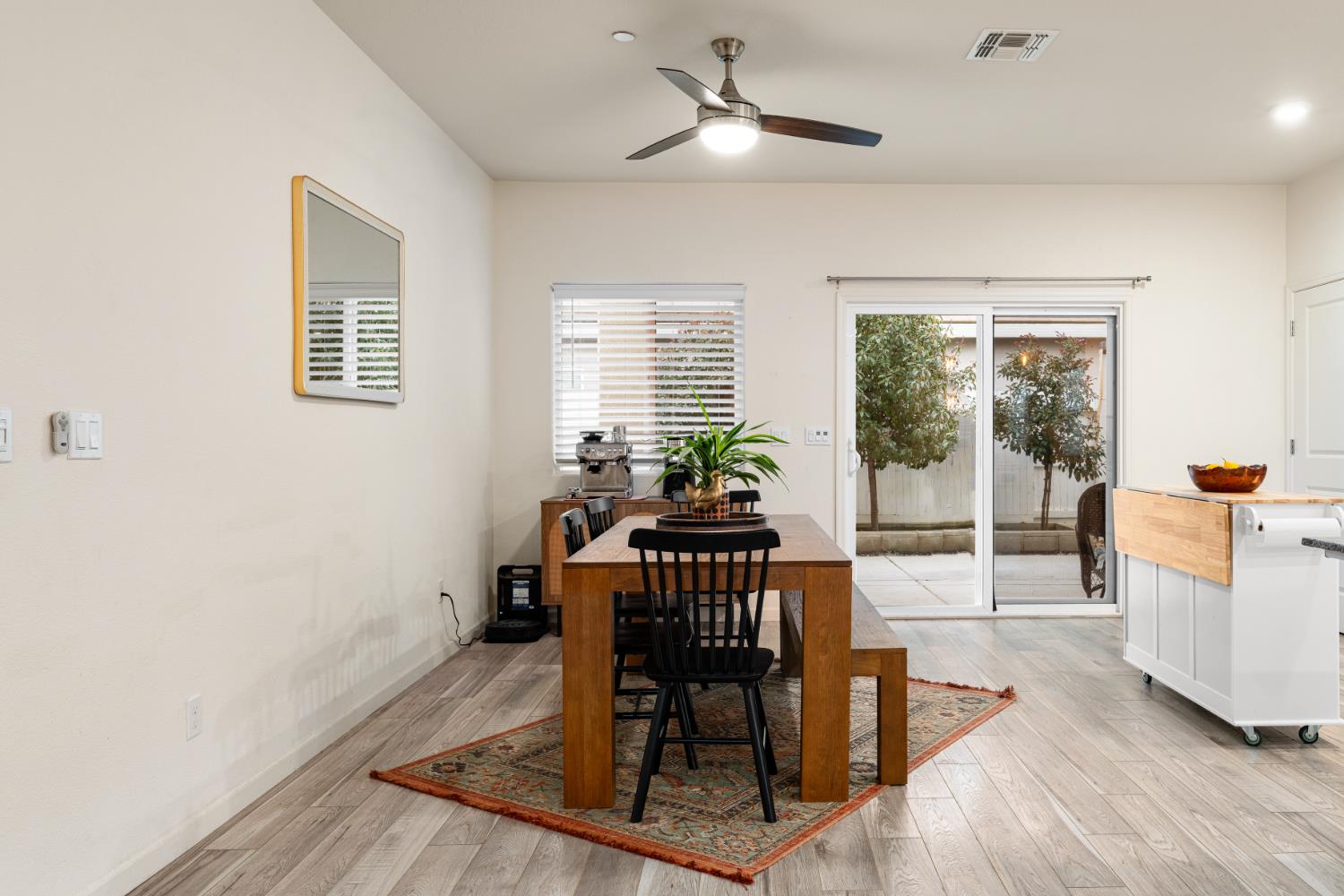 7457 Sobon Lane Rancho Murieta, CA 95683 - Photo 11 of 32 a view of a dining room with furniture window and wooden floor