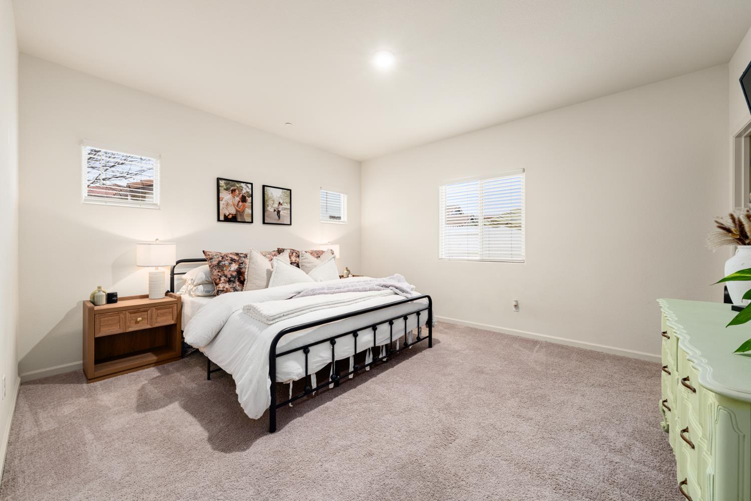 7457 Sobon Lane Rancho Murieta, CA 95683 - Photo 14 of 32 a spacious bedroom with a bed and a desk