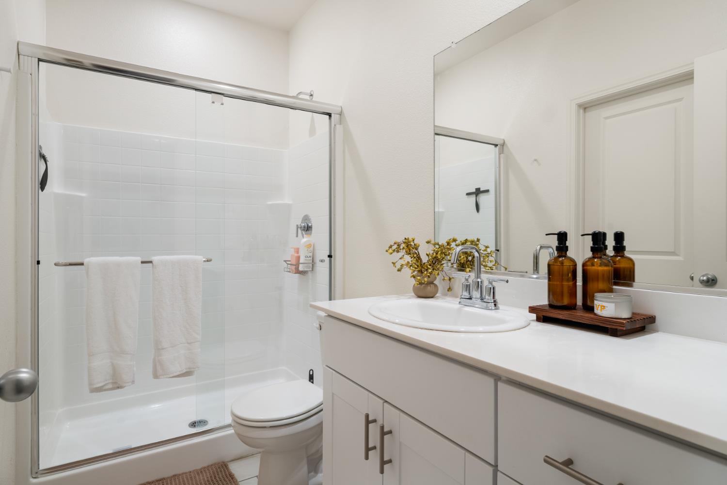 7457 Sobon Lane Rancho Murieta, CA 95683 - Photo 17 of 32 a bathroom with a sink a toilet and shower