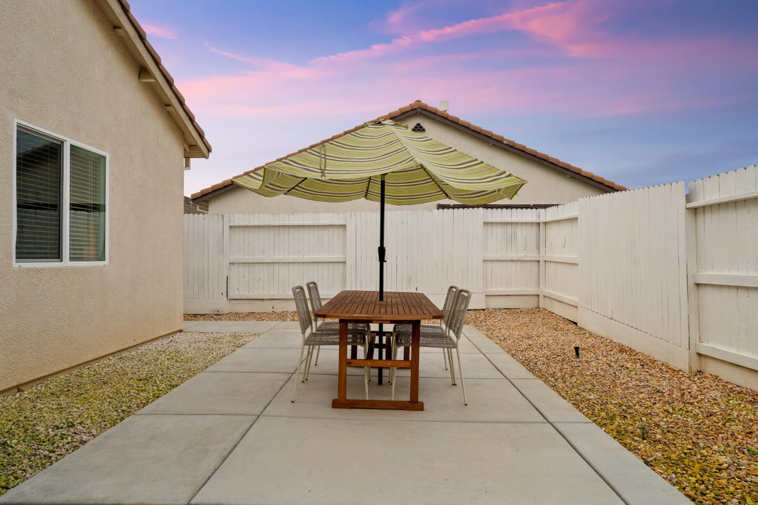 7457 Sobon Lane Rancho Murieta, CA 95683 - Photo 25 of 32 a backyard of a house with table and chairs