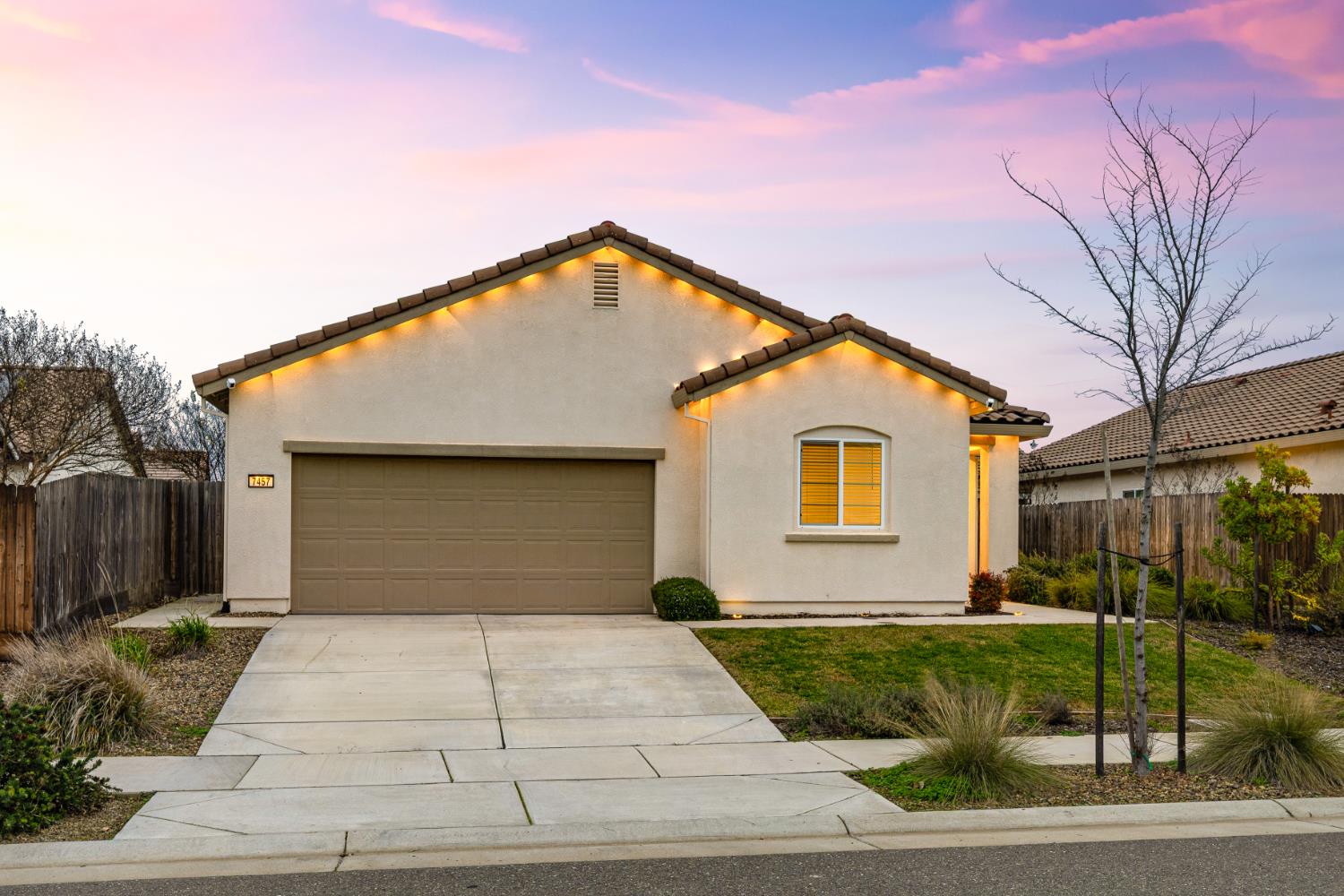 7457 Sobon Lane Rancho Murieta, CA 95683 - Photo 32 of 32 a front view of a house with garage and plants