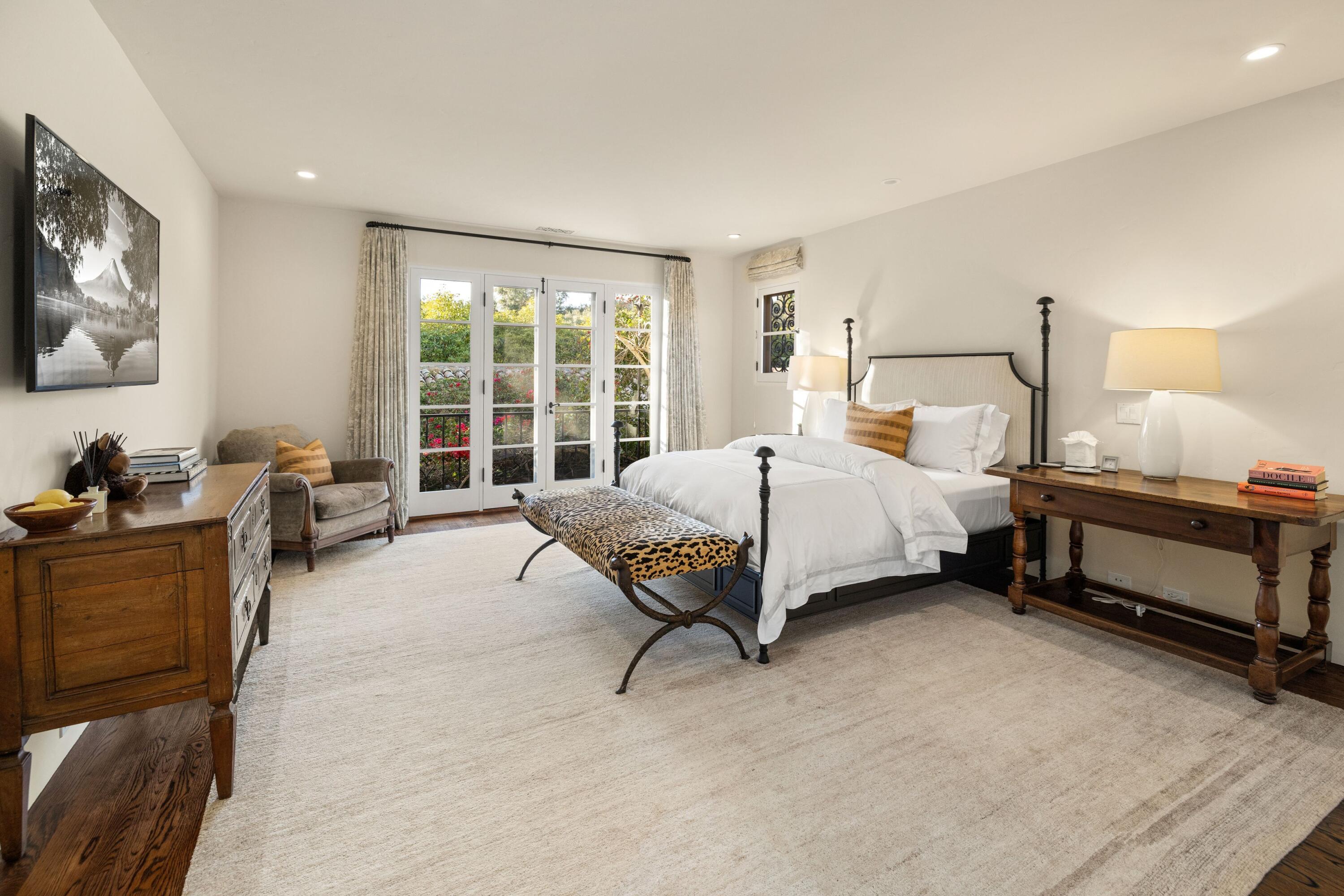 1284 Mesa Road Montecito, CA 93108 - Photo 14 of 26 a bedroom with a bed and a large window