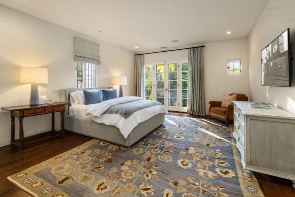 a bed room with a bed and a couch