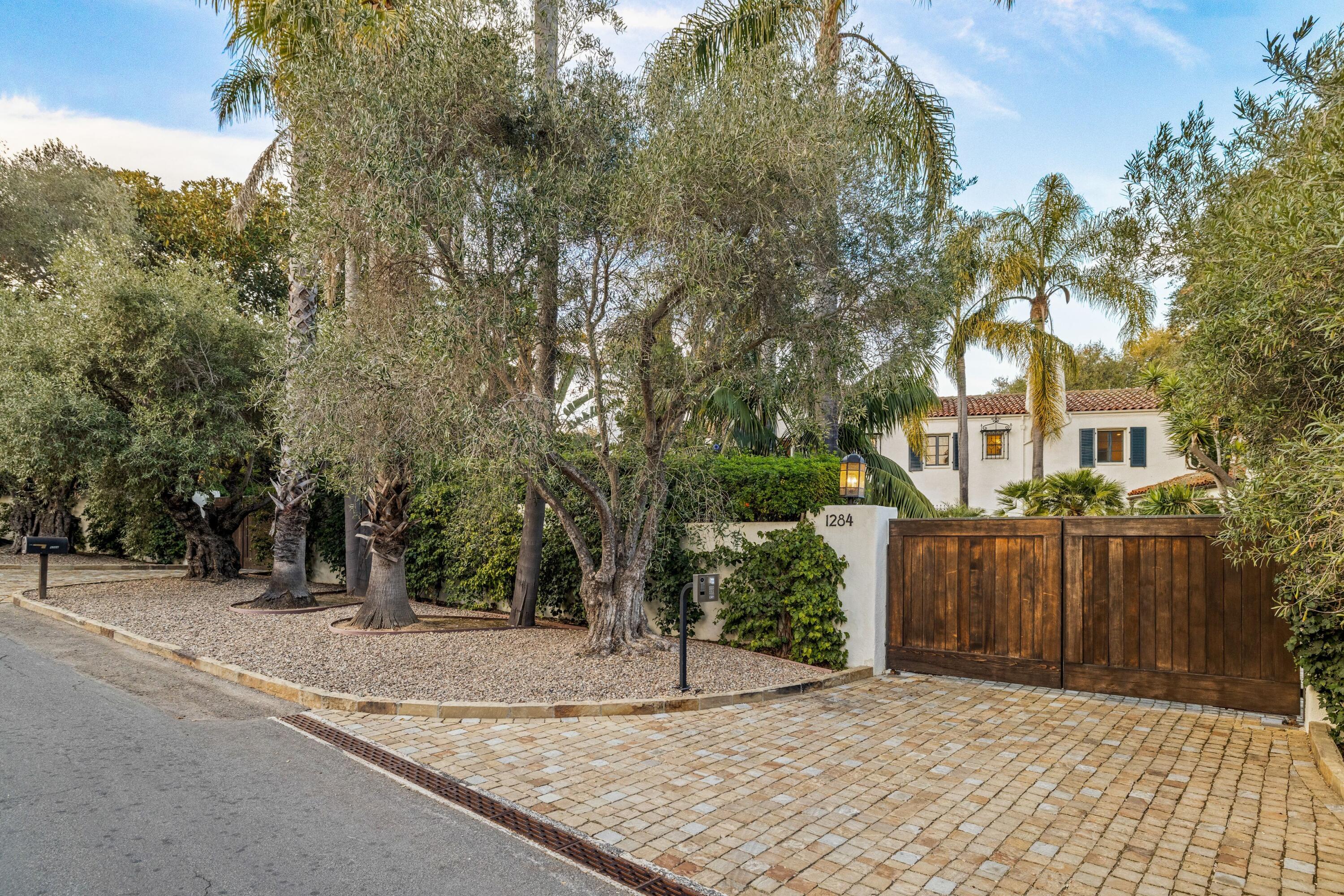 1284 Mesa Road Montecito, CA 93108 - Photo 3 of 26 a house with trees in front of it