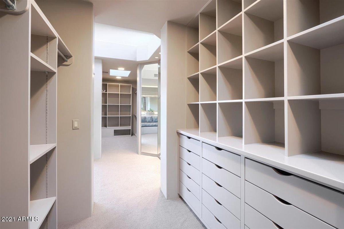 10040 East Happy Valley Road, Unit 661 Scottsdale, AZ 85255 - Photo 51 of 69 His and hers master closets