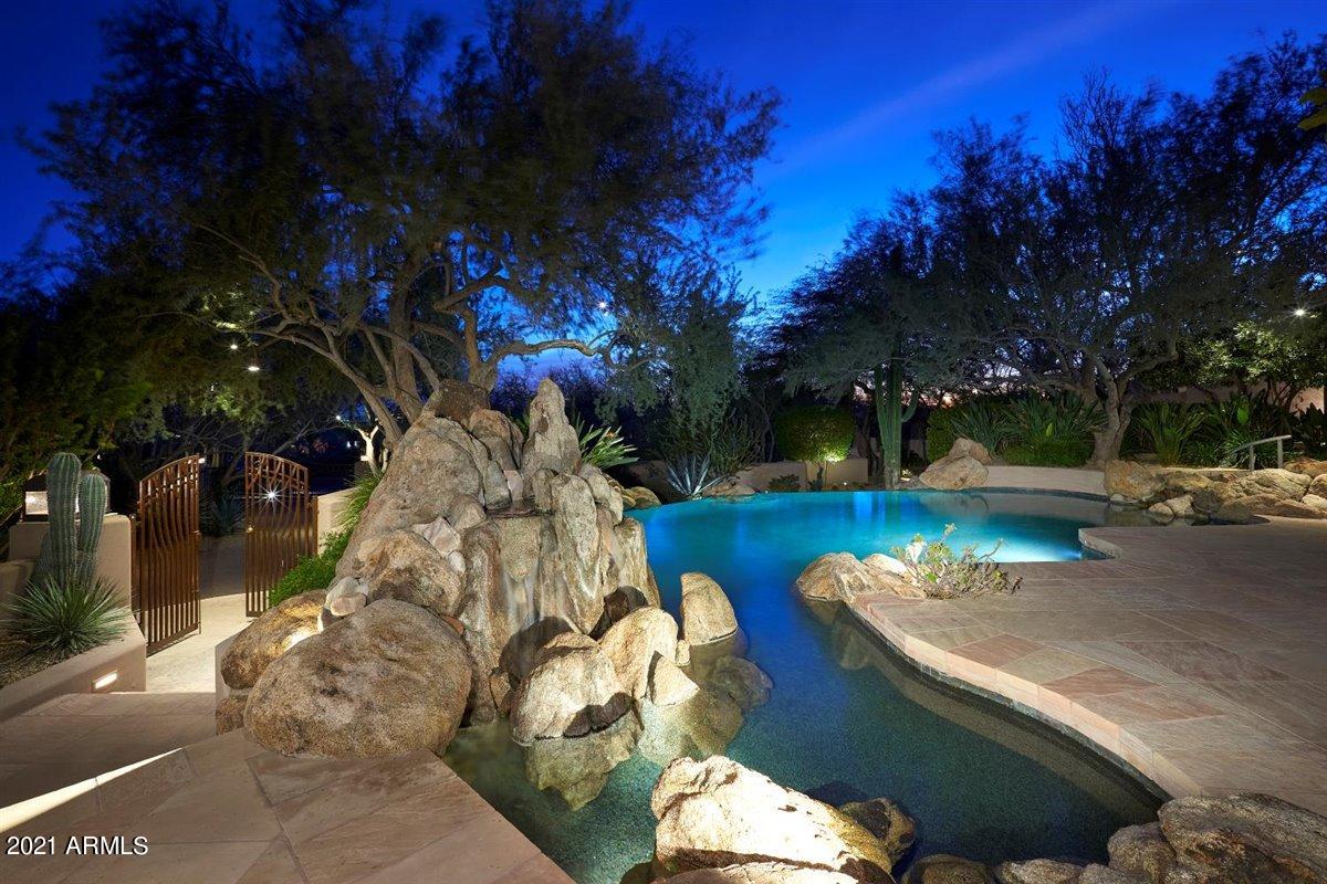 10040 East Happy Valley Road, Unit 661 Scottsdale, AZ 85255 - Photo 10 of 69 Pool with boulder water feature