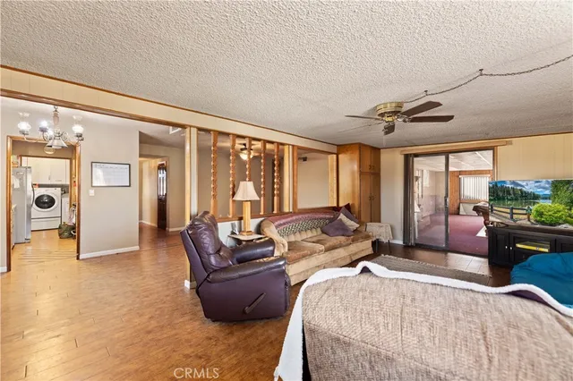 a bedroom with furniture and large windows