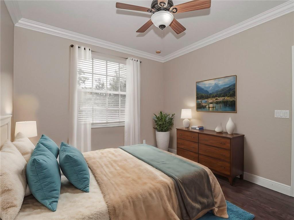 1931 Grey Falcon Circle Southwest Vero Beach, FL 32962 - Photo 18 of 36 a bedroom with a bed and a flat screen tv