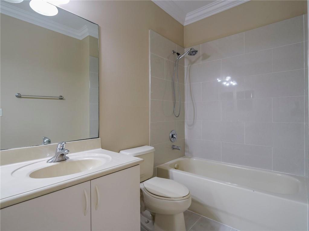 1931 Grey Falcon Circle Southwest Vero Beach, FL 32962 - Photo 21 of 36 a bathroom with a sink toilet and shower