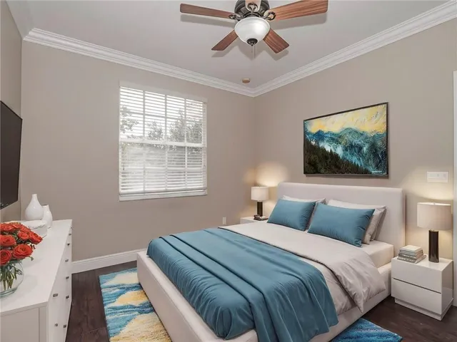 a bedroom with a large bed and a window